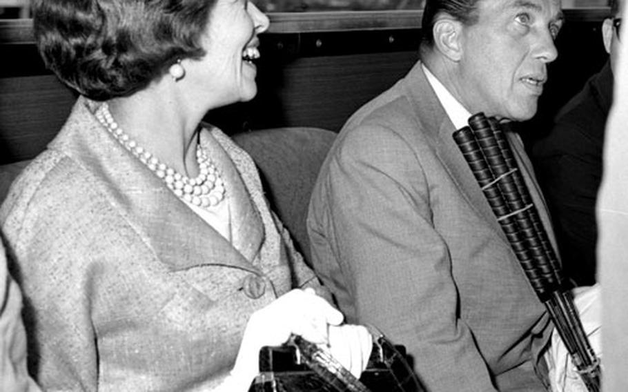 Ed Sullivan and his wife, Sylvia, ride the shuttle bus at the Frankfurt airport in July, 1961.