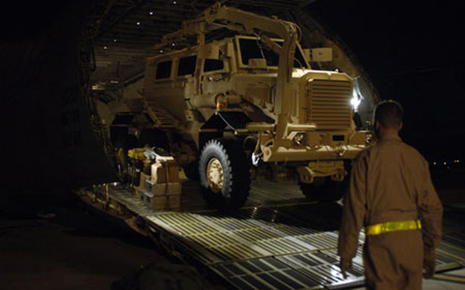 U.S. Air Force personnel load a MRAP vehicle onto a C-5 Galaxy assigned to the 436th Air Wing, Dover, Air Force Base, Del., at Charleston AFB, S.C., on Aug. 16. Air Mobility Command assists with the movement of MRAP vehicles to U.S. Central Command's area of responsibility as directed by the National Command Authority, the Joint Staff and U.S. Transportation Command.