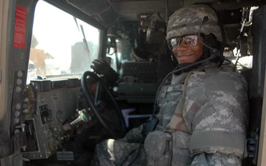 Pvt. Davena Fuller takes a moment for the camera while loading back up to return to Baghdad after accompanying a supply convoy on an Iraqi highway. The junior enlisted soldier is expertly qualified on four different weapons and is authorized to drive semi-trucks as well. She is the only female troop in her platoon in the 1st Cavalry Division’s 3rd Battalion, 82nd Field Artillery Regiment — part of the 2nd Brigade Combat Team.