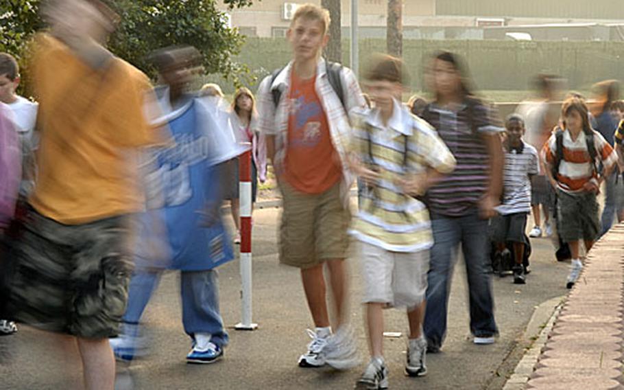 A river of students fresh off of summer vacation flowed through the elementary school campus during the first day back to school Monday at Ramstein, Germany.