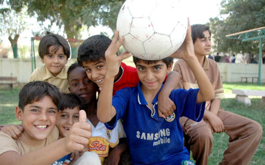 Children clown around while playing in the park adjacent to Abu Nuwas Street in eastern Baghdad. The children said they didn’t like to come to the area to play until it was recently cleaned up by the U.S.