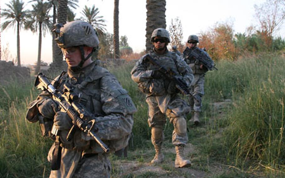Spc. Michael Collier, 22, of Jacksonville, Fla., left, Private 1st Class Randy Maldonado, 19, of Vista, Calif., and Private 1st Class Jesse Rinier, 23, of Long Valley, N.J., move out Wednesday on patrol at the start of Operation Tuwaitha Sunrise. The soldiers are with Delta Company, 1st Battalion, 15th Infantry Regiment, from Fort Benning, Ga. During the mission, U.S. forces accompanied local Iraqis to clear al Qaida insurgents from Tuwaitha, a village on the Tigris River, about 15 kilometers south of Baghdad.