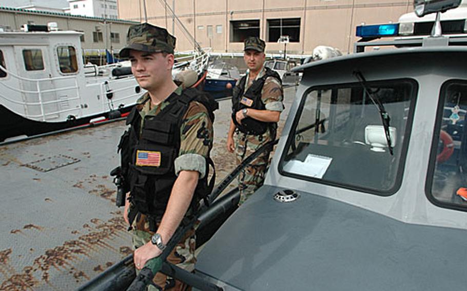 Petty Officer 2nd Class Jason Dillon and Petty Officer 3rd Class Steven Jacks rescued seven people, six from a boat being ripped to pieces on the "dragon’s teeth" artificial rocks set along Yokosuka Naval Base’s shoreline and one person clinging for his life on a channel marker in Tokyo Bay.