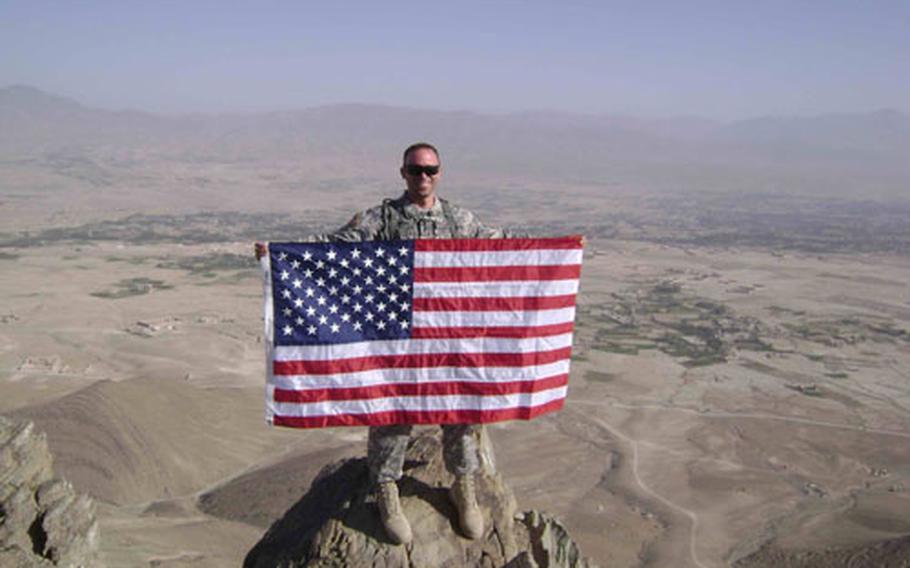 Master Sgt. Patrick Magnani stands on a mountain top near Gardez in Afghanistan in this picture taken earlier in his deployment. The 36-year-old soldier, assigned to the 31st Medical Support Squadron at Aviano Air Base, Italy, died in Afghanistan.