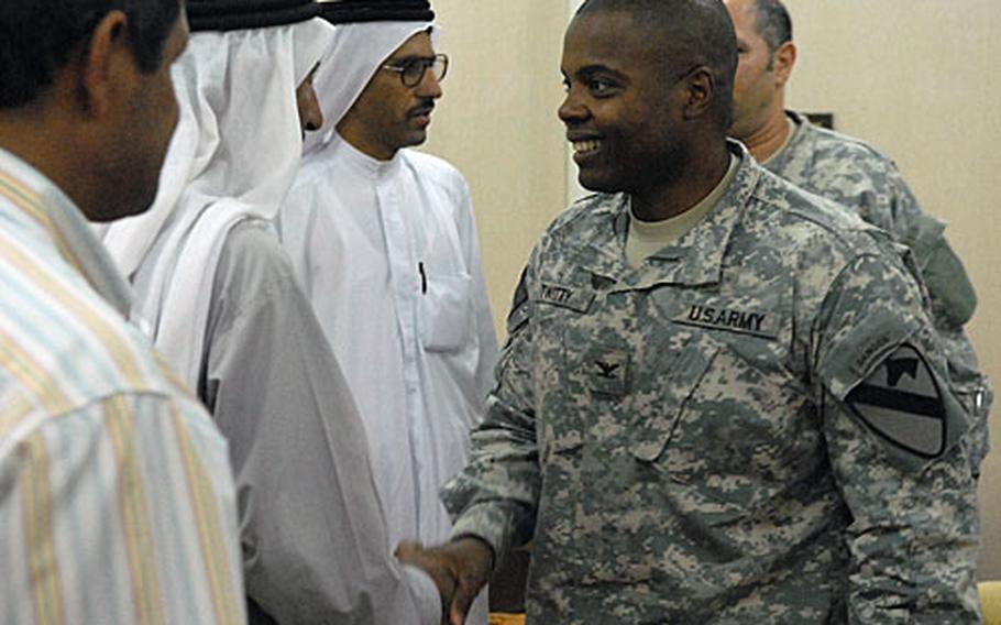 Col. Stephen Twitty, commander of the 1st Cavalry Division's 4th Brigade in northern Iraq shakes hands with officials from the town of Qayyarah after a meeting Tuesday at FOB Q-West in Nineveh province. The 3-man delegation from the town of roughly 22,000 met with Twitty to discuss plans to build a 100-bed hospital.