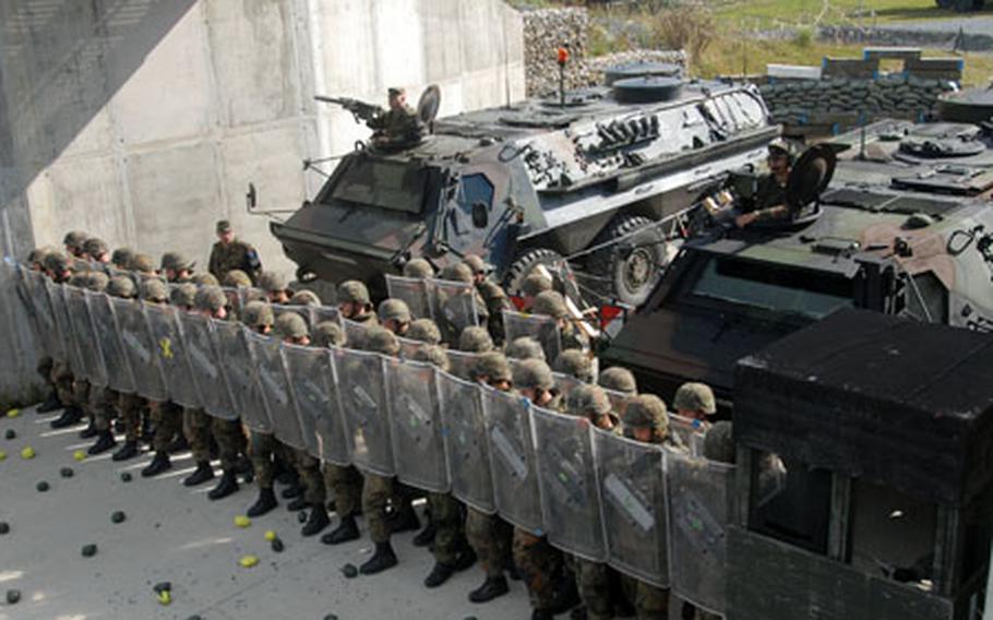 Germany's 12th Panzer Brigade troops practice riot control at Grafenwöhr Training Area on Thursday.