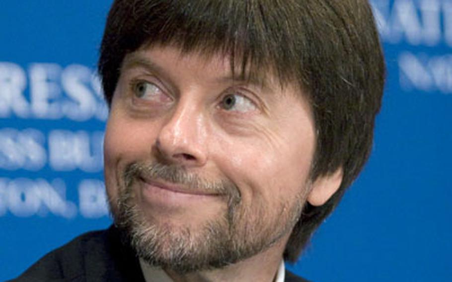 Filmmaker Ken Burns listens as head-table guests are introduced prior to his speech at the national Press Club in washington on Wednesday. Burns' World War II documentary, "The War," begins on PBS this weekend.