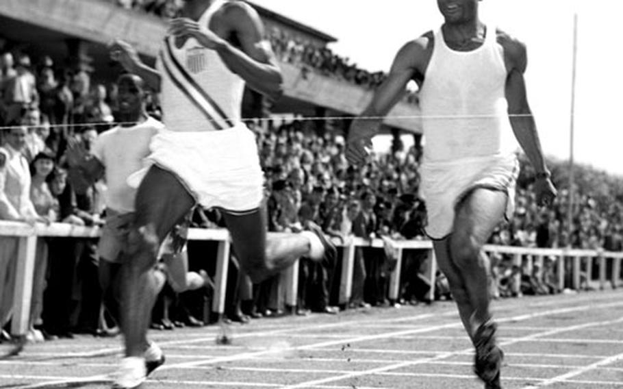 Harrison Dillard edges Barney Ewell in the 100-meter race at Frankfurt in August, 1948.