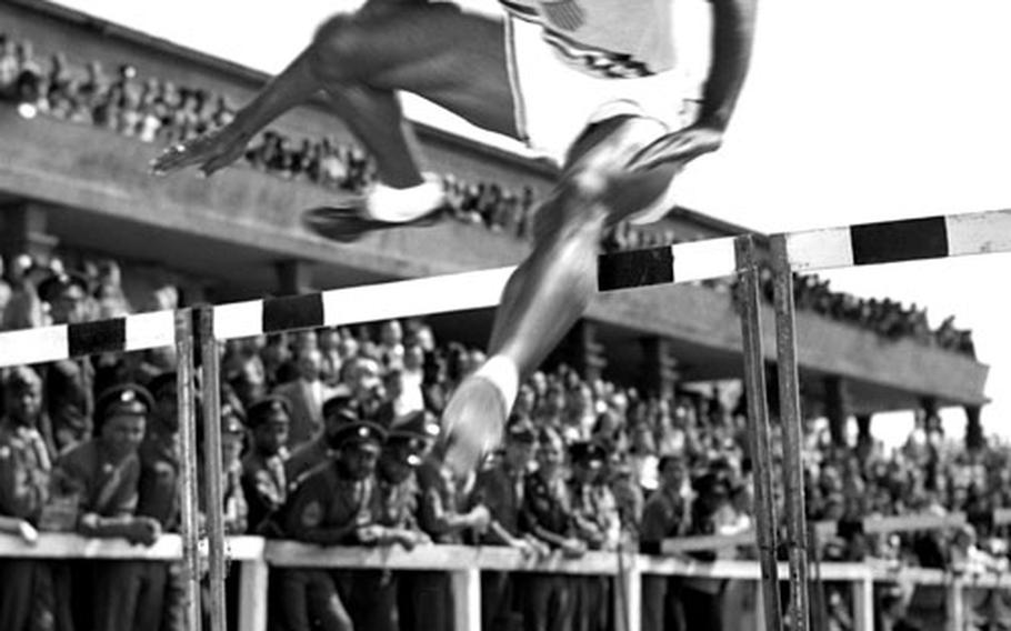 Harrison Dillard in his specialty, the hurdles.