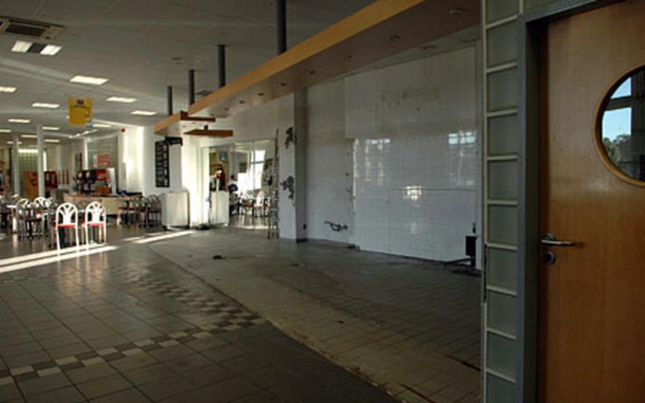 The empty space where Baskin-Robbins and Vescovi Coffee once sold ice cream and java is a constant reminder that the base is downsizing. Though Burger King and Anthony’s Pizza remain in the fast-food court, their hours have been decreased.