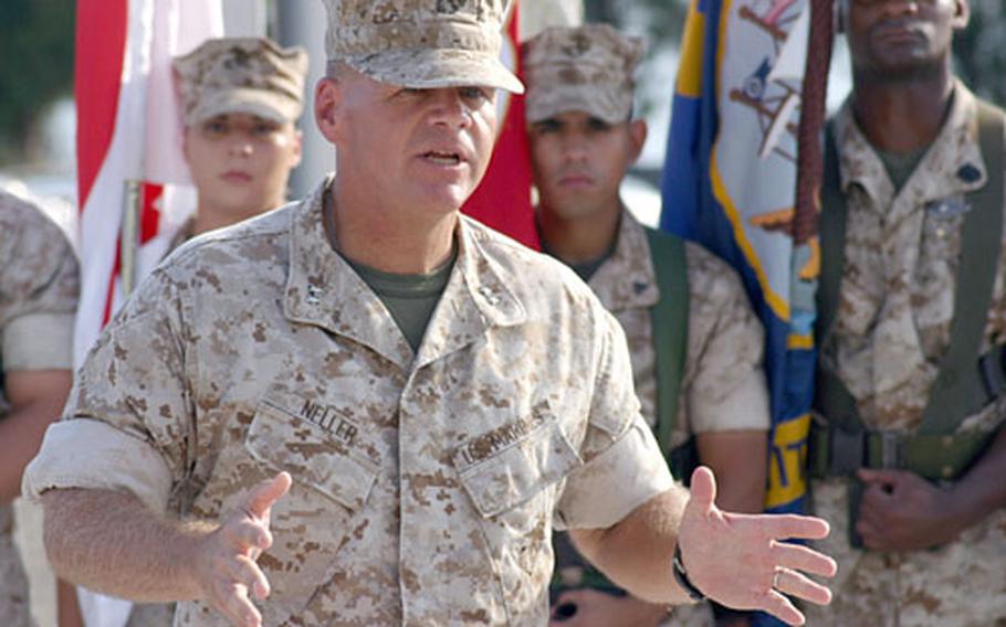 Maj. Gen. Robert B. Neller, 3rd Marine Division commander, talks to Marines at the division's 65th anniversary ceremony Monday on Camp Courtney, Okinawa. Neller took command of the division in June.