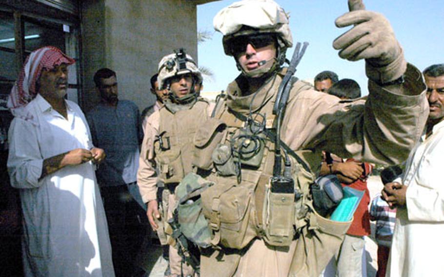The first step in figuring out civil affairs in a tribal community like Fallujah is finding out who the leaders are and where their territory starts and stops. Lt. Todd Richardson of 3rd Battalion, 3rd Marines gets some clarification on neighborhood borders in Subayht, Iraq.