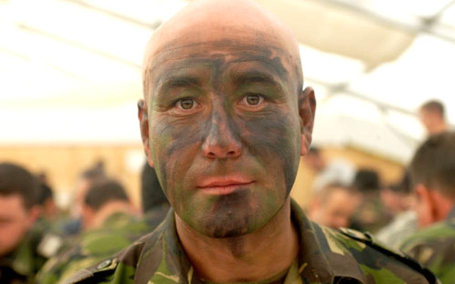 A Romanian sergeant at lunch in the Mihail Kogalniceanu air base, before a demonstration with his soldiers designed to showcase their fighting know-how and resolve.