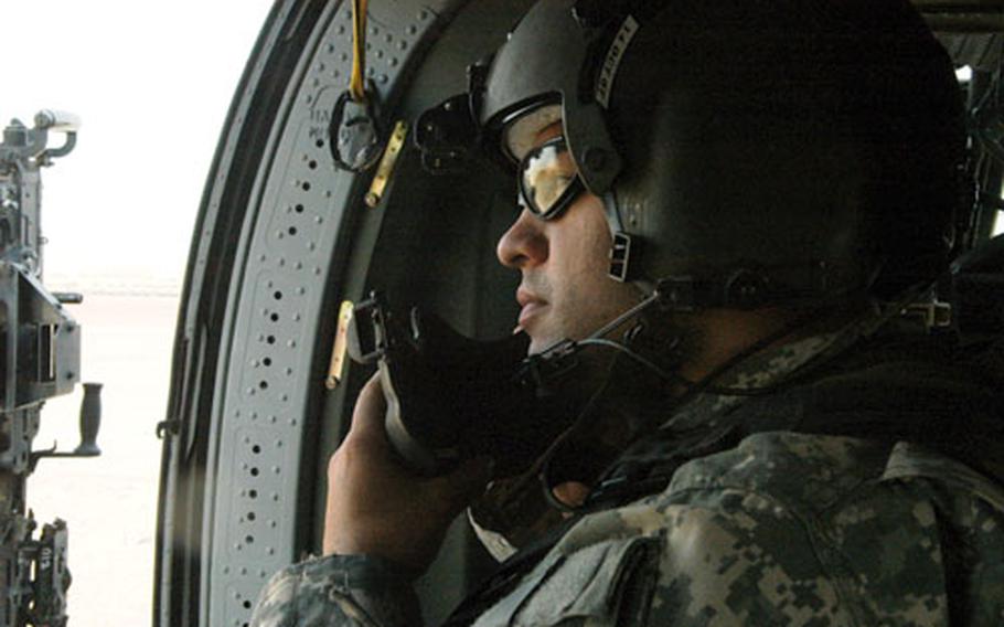 Spc. Isaac Mendoza of the 12th Combat Aviation Brigade readies for flight.