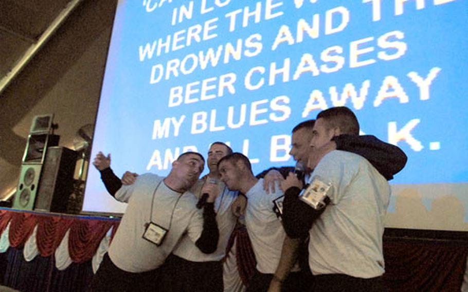Customers sing a ditty at Pete&#39;s on karaoke night, a popular diversion on Manas Air Base.