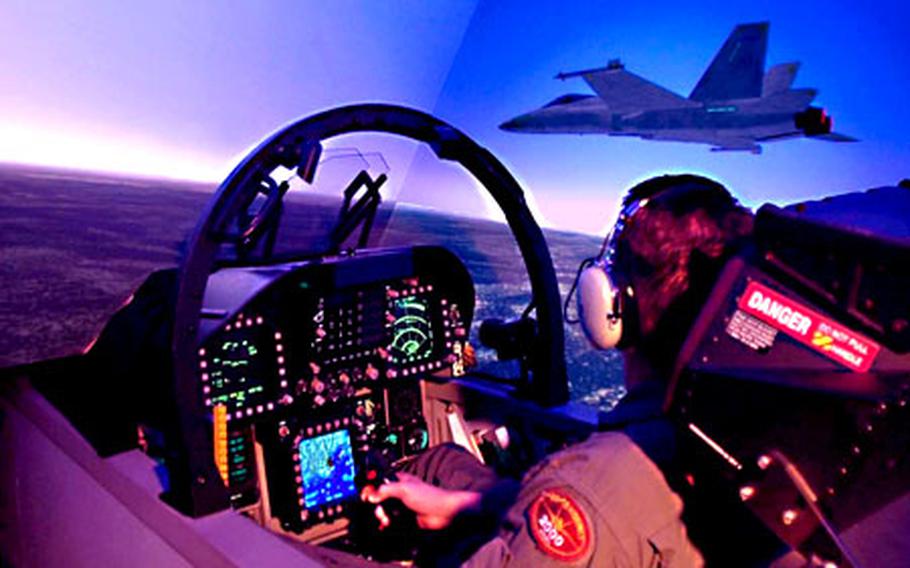 The Tactical Operational Flight Trainer, a dodecahedron-shaped visual system, is used by U.S. Navy F/A-18 pilots to train field and carrier takeoffs and landings, low-altitude flight, air-to-air and air-to-ground weapons delivery, electronic countermeasures and emergency procedures.