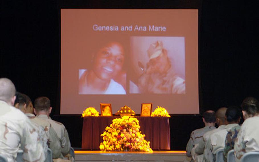 Servicemembers and Department of Defense personnel stationed at Bahrain gather gather during a memorial ceremony for Seaman Genesia Gresham and Seaman Anamarie Camacho.