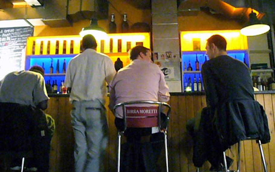 Patrons enjoy the mellow atmosphere inside the Juno bar.