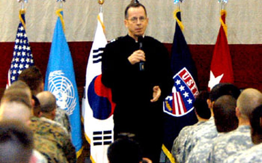 Chairman of the Joint Chiefs of Staff Adm. Mike Mullen addresses a crowd of servicemembers Wednesday in Collier Field House at Yongsan Garrison, South Korea.