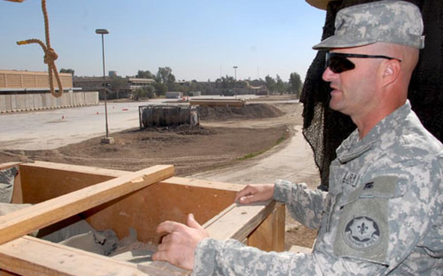 Company D, 2nd Squadron, 2nd Cavalry (Stryker) Regiment 1st Sgt. Michael White surveys Combat Outpost Aztec on Tuesday.
