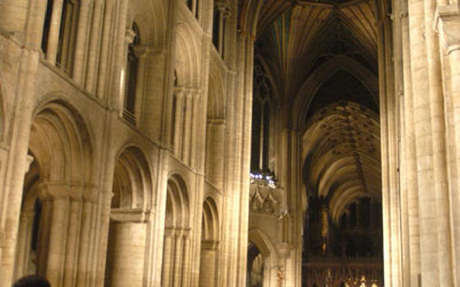 Worshippers stand for the procession of a Thanksgiving Eve service hosted by local Air Force communities inside the historic Ely Cathedral. The service dates back to World War II when British neighbors invited American troops to use the cathedral as a place of worship on the American holiday.