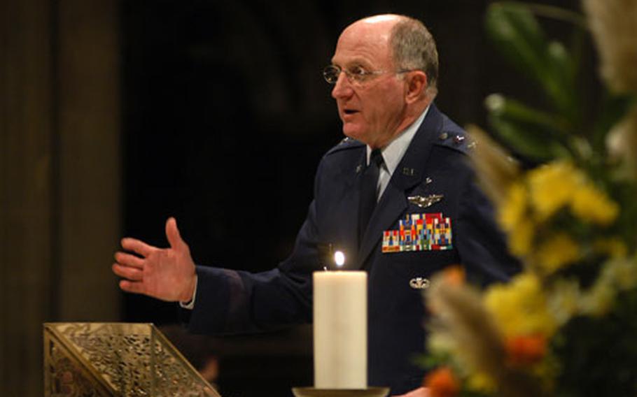 Chaplain (Maj. Gen.) Charles C. Baldwin, Air Force chief of chaplains, gives remarks during thr Thanksgiving Eve service.