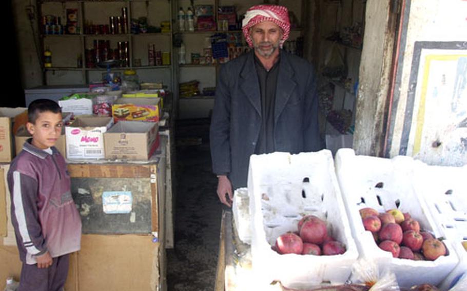 Sadoon Abdal Hassan and his son open for business Wednesday in Arab Jabour.