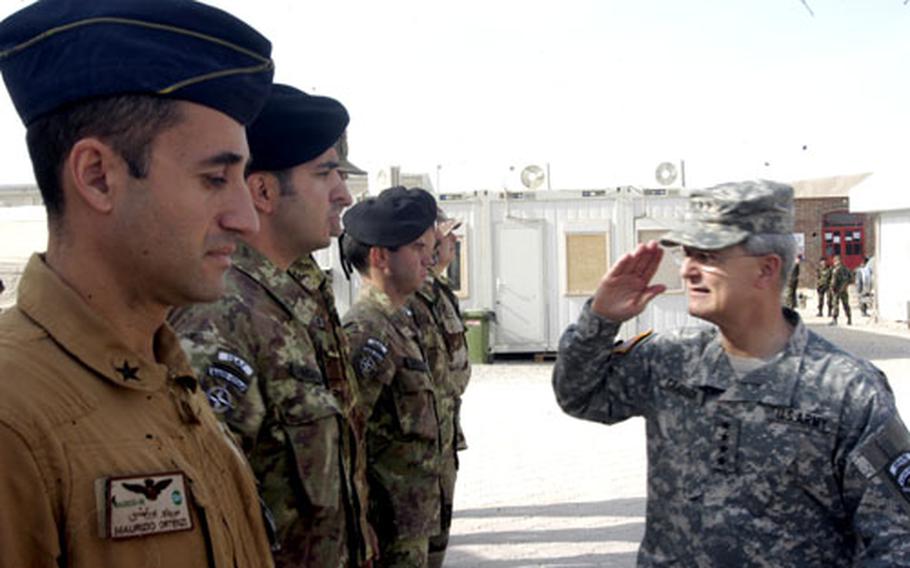 Gen. John Craddock, right, commander of the U.S. European Command and NATO forces, salutes Italian troops on Nov. 23 during a visit to Herat, Afghanistan. "If we're really serious about tomorrow, we've got to shape tomorrow" Craddock said, referring to future civil-military efforts by NATO and the U.S. European Command.