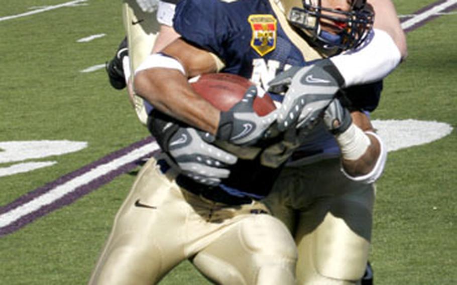 Army's Brian Chmura hauls down Navy's Zerb Singleton, holding him to a gain of only two yards in the first quarter of Saturday's game at Baltimore.