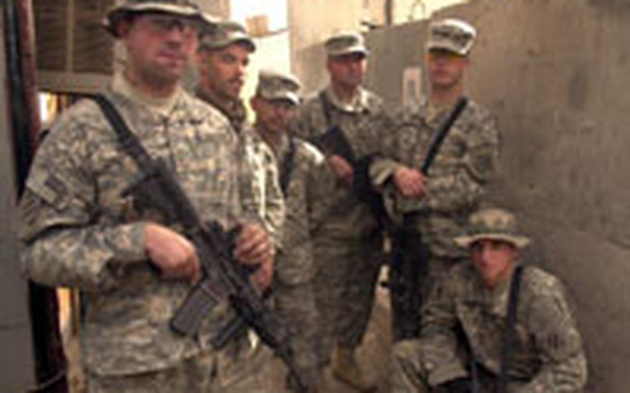 Soldiers from Company A, 3rd Battalion, 7th Infantry, 4th Brigade, 3rd Infantry Division gather at Patrol Base Jurf the day after the first firefight of their deployment. One Iraqi man was seriously injured, but no U.S. soldiers were hurt. From left: Pfc. Jeremy Hughes, Sgt. Jason Boyd, Staff Sgt. Mark Matekovic, Staff Sgt. Marcus Coe, Pfc. William Furgason, Pfc. Kenneth Purvis.