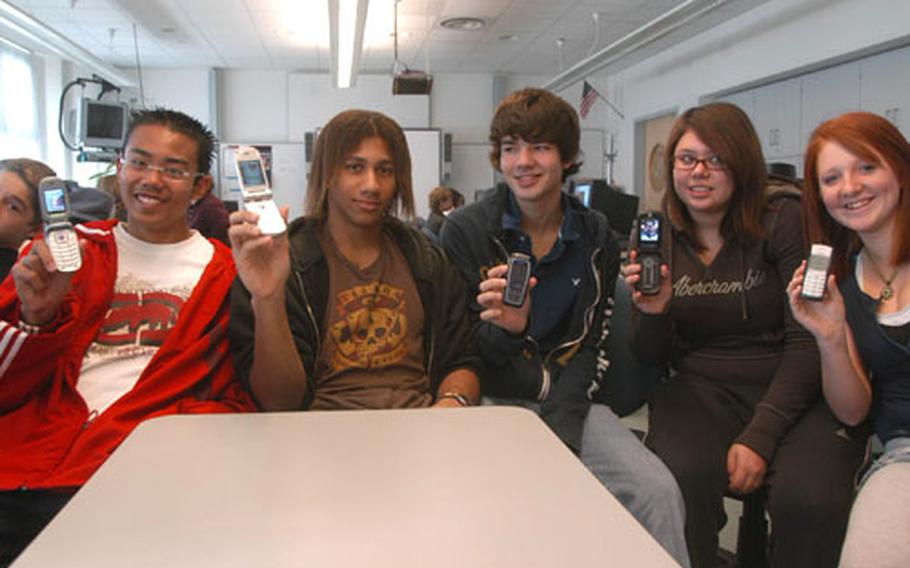 Aviano High School students Francis Ledesma, Dante Rankin, Andy Kreutz, Katie Evans and Hannah Watson all have their own cell phones. They do a lot of text messaging, but not in class. Students at Aviano are only allowed to use their cell phones before classes start, at lunch and after school. Many students keep their phones set on vibrate.