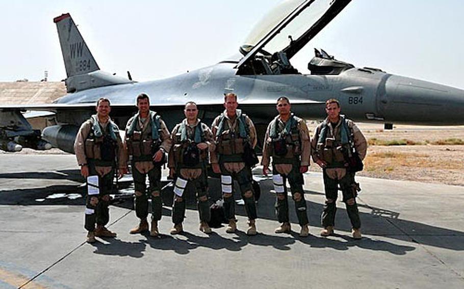 Lt. Col. Steve Williams, 13th Fighter Squadron commander, far left, stands in front of an F-16 Fighter jet this summer at Balad Air Base, Iraq, with some of his pilots, including Capt. Larry Sullivan, third from left; Capt. Chris Struve, third from right; Maj. Mike Briggs, second from right; and Capt. Kevin Hicok, far right. The pilots from Misawa Air Base, Japan, were preparing for a combat mission on Aug. 12.