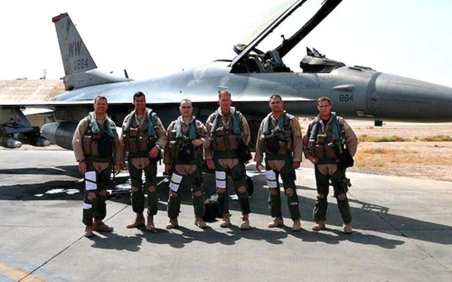 Lt. Col. Steve Williams, 13th Fighter Squadron commander, far left, stands in front of an F-16 Fighter jet this summer at Balad Air Base, Iraq, with some of his pilots, including Capt. Larry Sullivan, third from left; Capt. Chris Struve, third from right; Maj. Mike Briggs, second from right; and Capt. Kevin Hicok, far right. The pilots from Misawa Air Base, Japan, were preparing for a combat mission on Aug. 12.