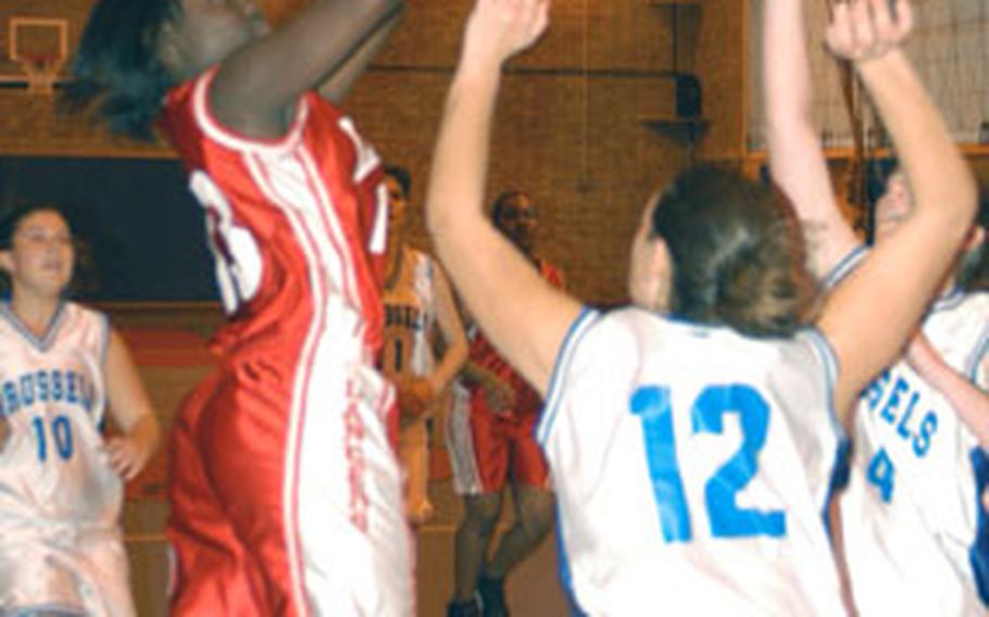 Tekeia Wallace goes up for two of her seven points in the Lady Lancers' two-point home win over Brussels on Saturday.
