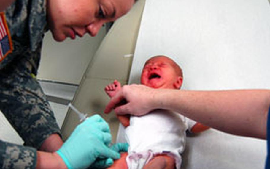 Sgt. Jennifer Bates, 75th Medical Company Area Support, gives a hepatitis B shot to five-day-old Anna Foxx as part of her immunology training at 121st Combat Support Hospital on Tuesday at Yongsan Garrison, South Korea.