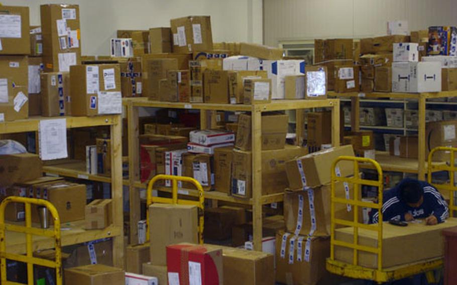 Thousands of pieces of mail waiting for delivery pile up at the Navy’s Capodichino Post Office following the delay caused by the three-day trucking strike in Naples.