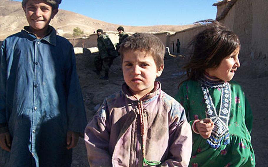 Children in southern Afghanistan's Dey Chopan District are curious and eager for treats when American soldiers pass.