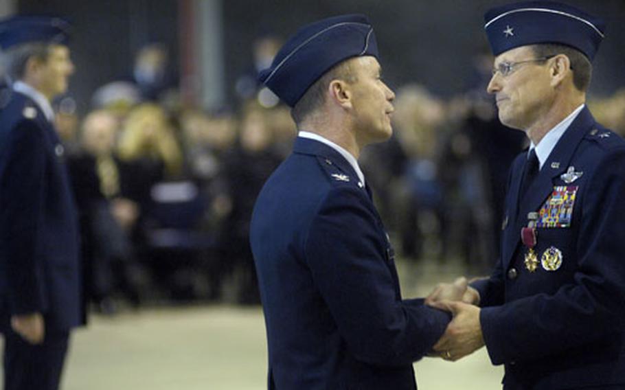 Brig. Gen. Rich Johnston, right, the 86th Airlift Wing and Kaiserslautern Military Community commander, talks with Col. Kevin Ross, commander of the 86th Contingency Response Group, during Johnston’s final review of troops Wednesday during a change-of-command ceremony at Ramstein Air Base, Germany.