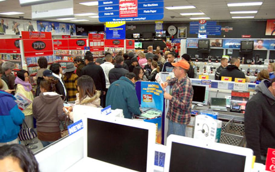 Customers crowd the Yongsan Garrison, South Korea, post exchange the day after Thanksgiving in this Stars and Stripes file photo. AAFES officials have reported that shoplifting is on the rise in their Pacific stores.