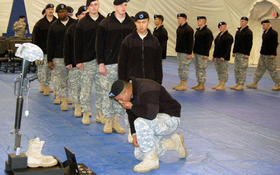 Soldiers from 1st Battalion, 72nd Armor Regiment, line up during a memorial service for Pfc. Christopher Adan on Friday at Camp Casey, South Korea. Adan was found dead in his room on Monday, making it the third death the 1st Heavy Brigade Combat Team has suffered this year.