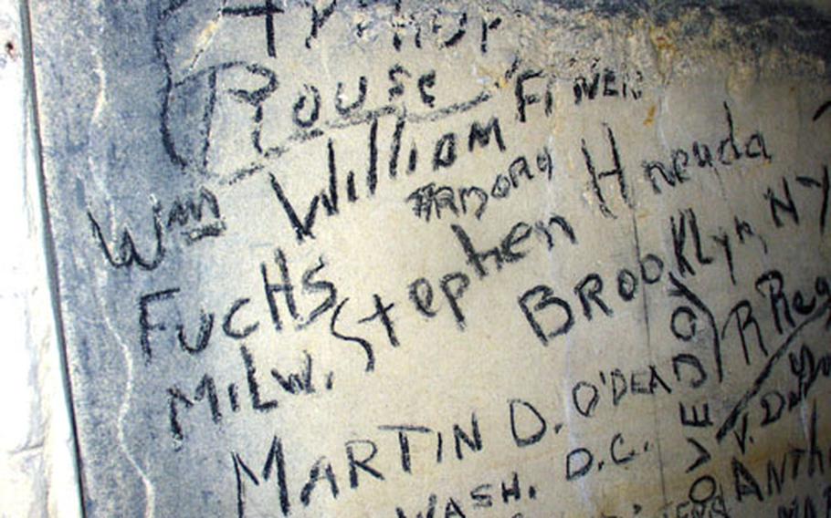 The names of World War II U.S. Army troops headed for the Battle of the Bulge adorn the wall of a cave near Maastricht, Netherlands. The troops had gathered in the cave for a Christmas Eve Mass in 1944. For years, local residents, along with some Americans from the nearby Army post at Schinnen, returned to the cave for a Christmas Eve service in their honor. The cave currently is closed for safety reasons.