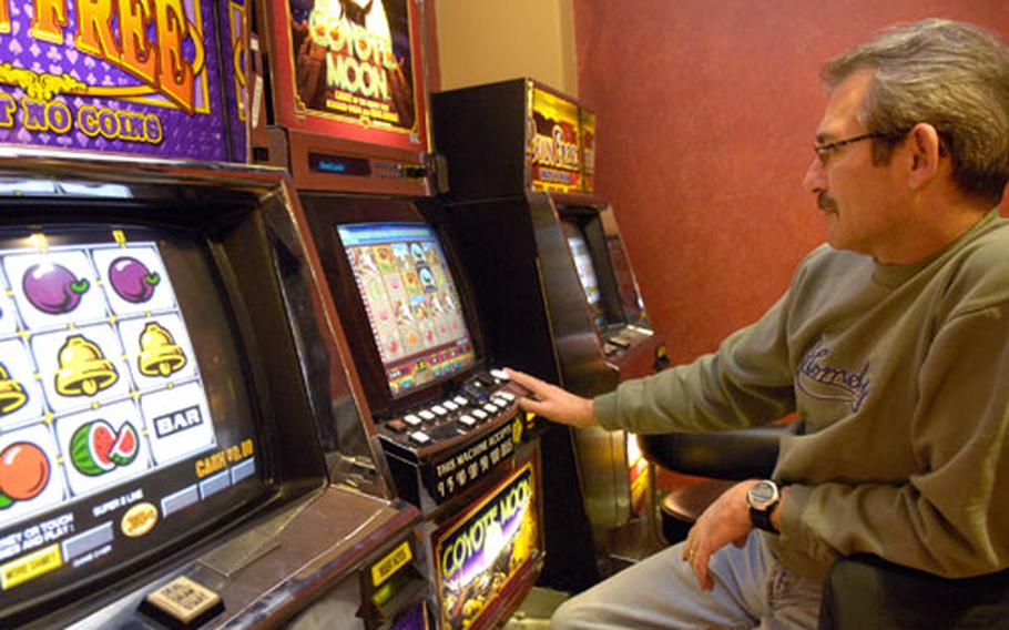 Bill Whipple tries his luck at one of Baumholder’s slot machines Dec 17th, 2007 at Striker’s bowling alley. A bill has been introduced in Congress that would eliminate gambling on all military bases overseas, including slot machines and bingo games in military clubs.