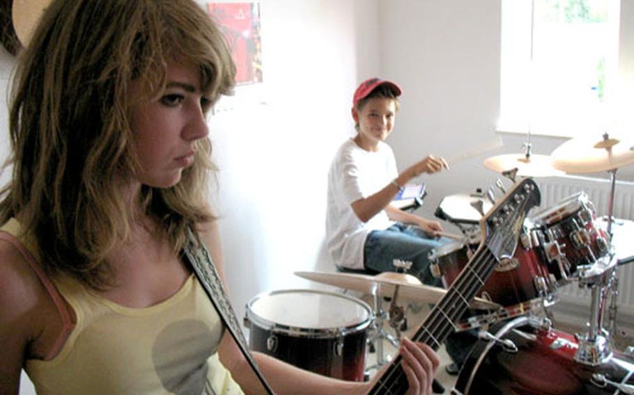 Carlotta Gärtner, left, and Sebastian Von Westernhagen jam during a band project at the Modern Music School in Heidelberg, Germany. The music school offers English-language lessons to those more serious musicians.