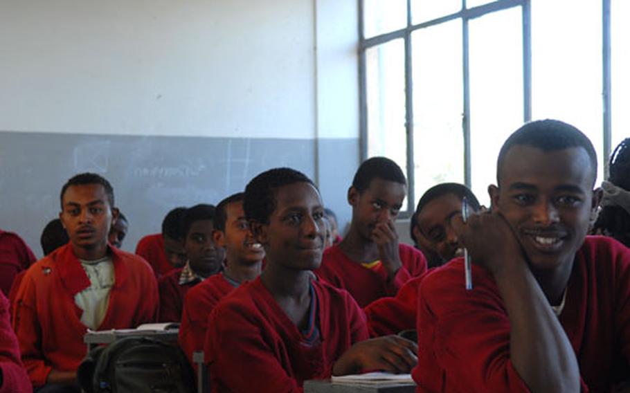 Students at Abiot Ermeja Elementary School in Addis Ababa, Ethiopia, listen to their lessons on Wednesday. According to teachers of the school, many students survive on the streets by their wits when they are not in class.