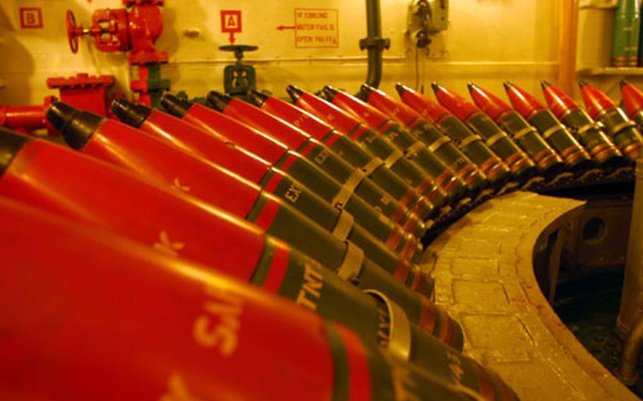 A row of retired ordnances in the belly of the HMS Belfast.