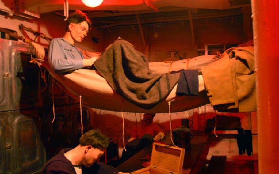 A collection of mannequins demonstrate the living quarters inside the MHS Belfast.