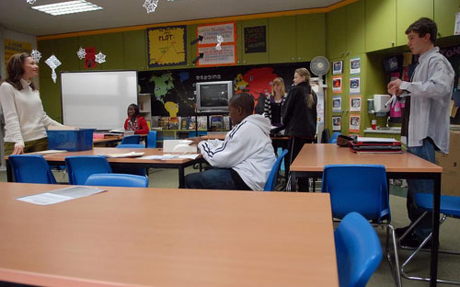Laura Stewart, left, prepares her eighth-grade language arts class for a test at Darmstadt Elementary School/Middle School on Thursday.