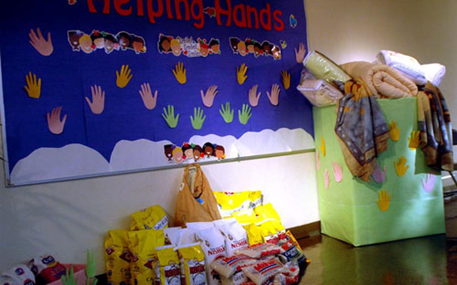 Bags of rice and a box of blankets donated by Yokota West Elementary School students and faculty sit on display in the school's cafeteria. It all will be donated to a Tokyo church which feeds and ministers to the homeless.