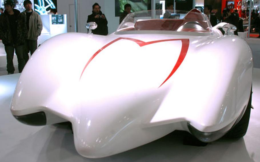 A custom copy of the Mach 5 car that was made famous by the “Speed Racer” cartoon series sits on display at the Auto Salon 2008.