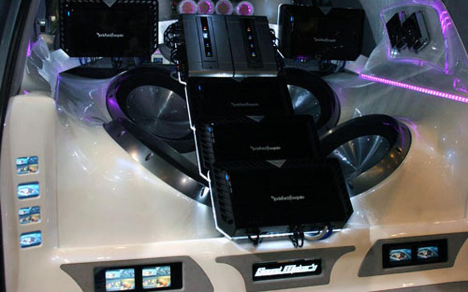 A Cadillac Escalade’s sound system was modified with 32 speakers. The vehicle also featured 78 tiny television screens.